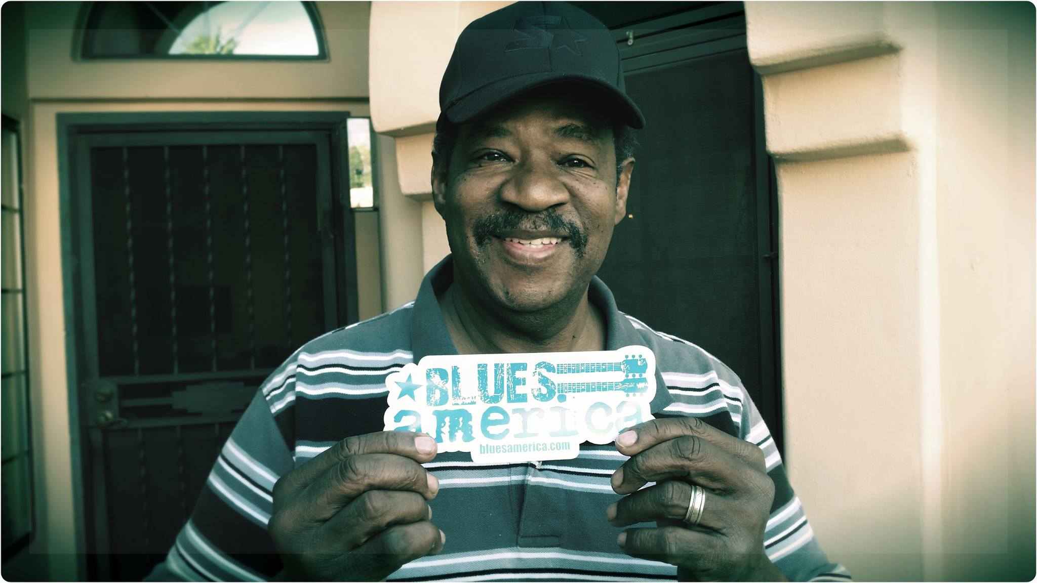 Jerry Lawson posing with Blues America sticker
